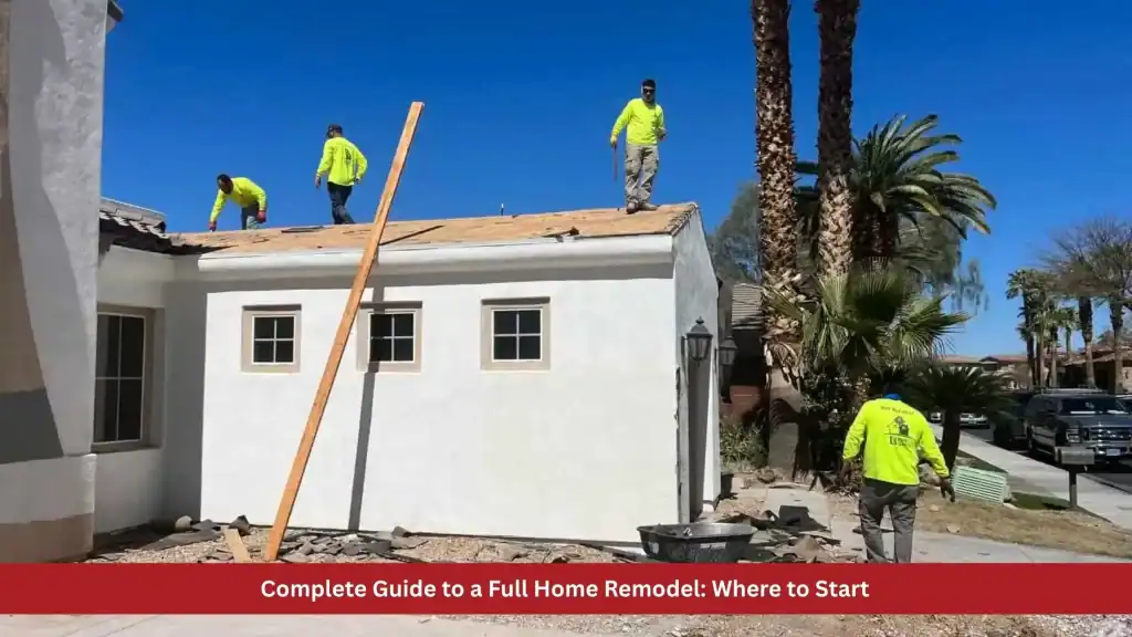 Roofers in neon yellow shirts working on a white stucco house during a home remodel.