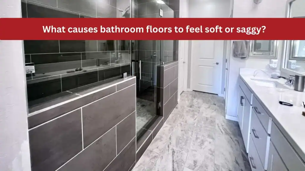 What causes bathroom floors to feel soft or saggy