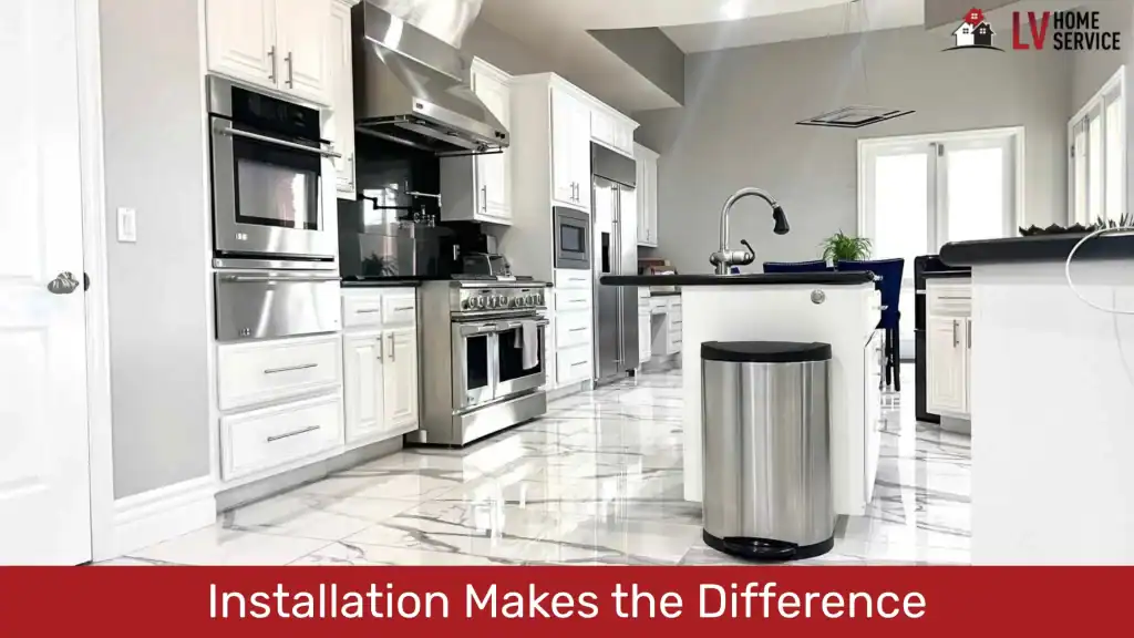 Modern kitchen with white cabinets and polished tile flooring.